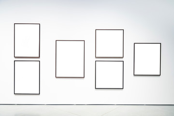 Blank empty golden frame on white background. Art gallery, museu