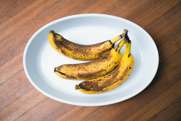 Top view of brown spotted bananas. Banana with dark black spots