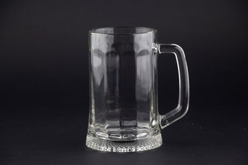 Big, glass beer glass on a white background