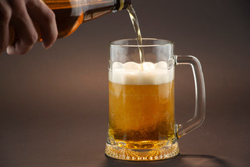 Bright, cold beer in a glass of glass