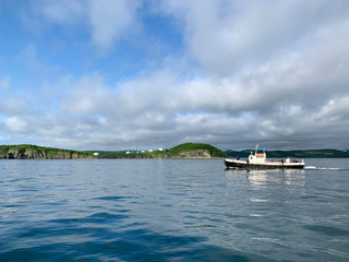 Vladivostok, Russia, 08.06.2019. Small vessel at cape Balka on Russkiy island in summer morning