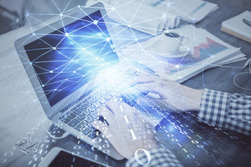 Double exposure of forex chart with man working on computer on background. Concept of market analysis.
