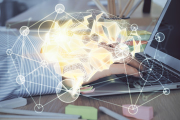 Man typing on keyboard background with brain hologram. Concept of big Data. Double exposure.