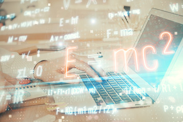 Science formula hologram with man working on computer on background. Education concept. Double exposure.