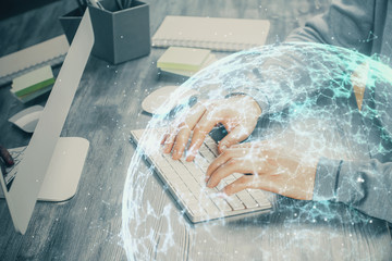 Social network theme hologram with businessman working on computer on background. Concept of world...