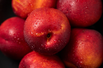 Close up of fresh ripe nectarines with water drops