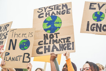Group of demonstrators on road, young people from different culture and race fight for climate...