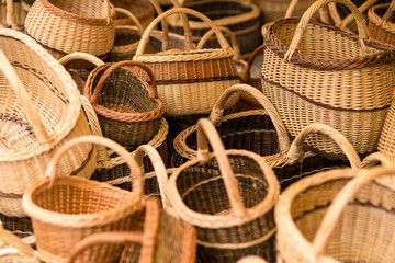 Hand made wicker woven baskets on display in a city fare. Handma