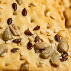 Square background of cookies with sunflower seeds and sesame is macro