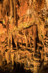 Fototapeta na wymiar Beautiful cave formations with stalagmites and stalactites deep