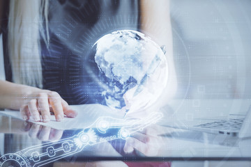 Multi exposure of hands making notes with world map hologram and data theme icons. Concept of global computer data.