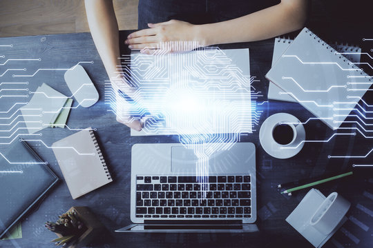 Multi exposure of writing hand on background with brain hologram. Concept of learning.