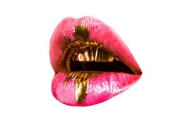 Luxury lips. Woman mouth isolated on white background. Decorated gold teeth. Bright lipstick. Fashion style.