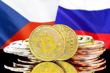 Concept for investors in cryptocurrency and Blockchain technology in the Czech Republic and Russia. Bitcoins on the background of the flag Czech Republic and Russia.