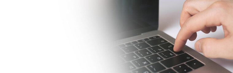 Man hand press enter laptop keyboard with white background. Copy space