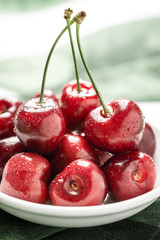 Organic Red Cherries with Fresh Water Drops as Summer Concept
