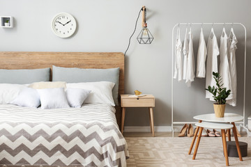Big bed in stylish interior of room