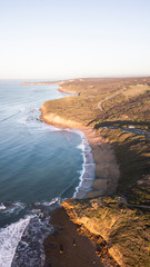 Aerial View of Waves and Surfers and Beach Landscape of Bells Beach Along the Great Ocean Road, Australia