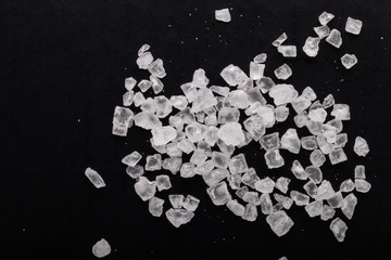 Cristals of sea salt on black background