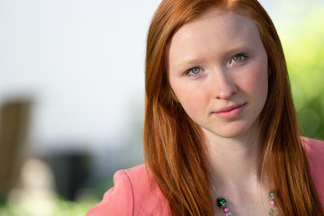 Fototapeta premium Portrait of redhead girl outside