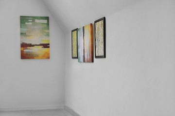 Fototapeta premium Pictures on wall in modern art gallery