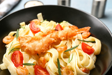 Tasty shrimps and pasta on plate, closeup