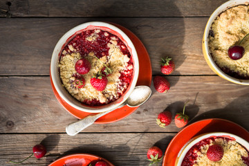 sweet pie. crumble with strawberries and red merry. Summer strawberry tart with crumble, top view