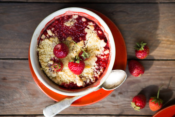 sweet pie. crumble with strawberries and red merry. Summer strawberry tart with crumble, top view