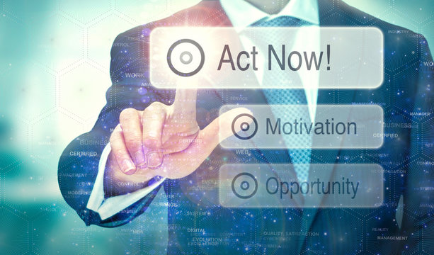 A businessman selecting a button on a futuristic display with a  Act Now concept written on it.