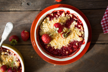 sweet pie. crumble with strawberries and red merry. Summer strawberry tart with crumble, top view