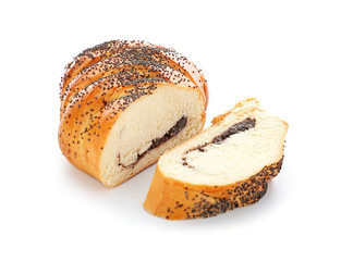 Tasty cut bun with poppy seeds on white background