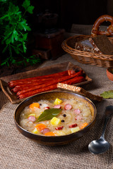 rustic sauerkraut soup with bacon and sausage