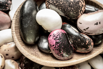 Colorful Beans and Wooden Spoon on Rustic Dark Background