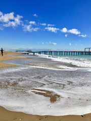 Wooden pier in Newport Beach,landscape green blue.