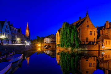 Classic view of the historic city center of Bruges (Brugge), West Flanders province, Belgium. Night cityscape of Bruges.