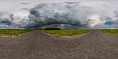 full seamless spherical hdr panorama 360 degrees angle view on asphalt road among fields in evening...