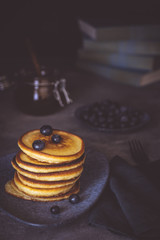 Fresh Pancakes with Organic Maple Syrup and Berries on Dark Background