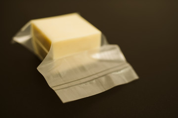 A piece of delicious cheese in the package