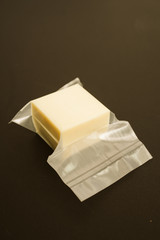 A piece of delicious cheese in the package