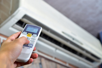 hand control air conditioner remote, controling temperature.
