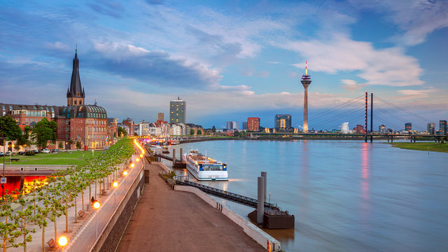 Dusseldorf, Germany. Panoramic cityscape image of riverside Düsseldorf, Germany with Rhine river during sunset.