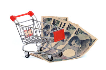 Japanese Yen banknotes money in shopping cart.This has clipping path