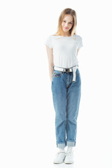 Fototapeta premium smiling shy teenage girl looking at camera isolated on white