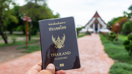Traveler holding Thailand passport in Ayutthaya Province Thailand