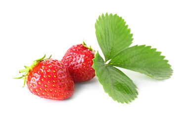 Ripe red strawberry and leaves on white background