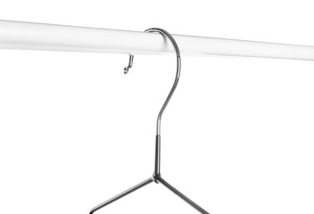 Rack with clothes hanger on white background, closeup
