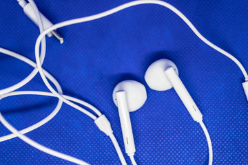 White headphones for phone or music player, device concept - I,age