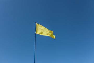 Yellow Flag with blue sky
