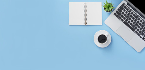 Business concept, relaxation in working time, drinking coffee taking a break on clean light blue office table, copy space, flat lay, top view, mockup