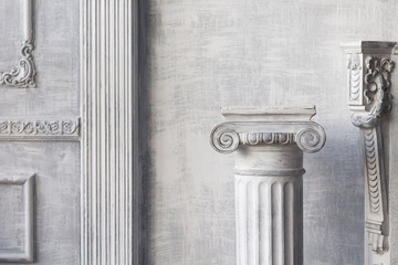 Stone column on light gray background. Close-up, copy space, front view - obrazy, fototapety, plakaty